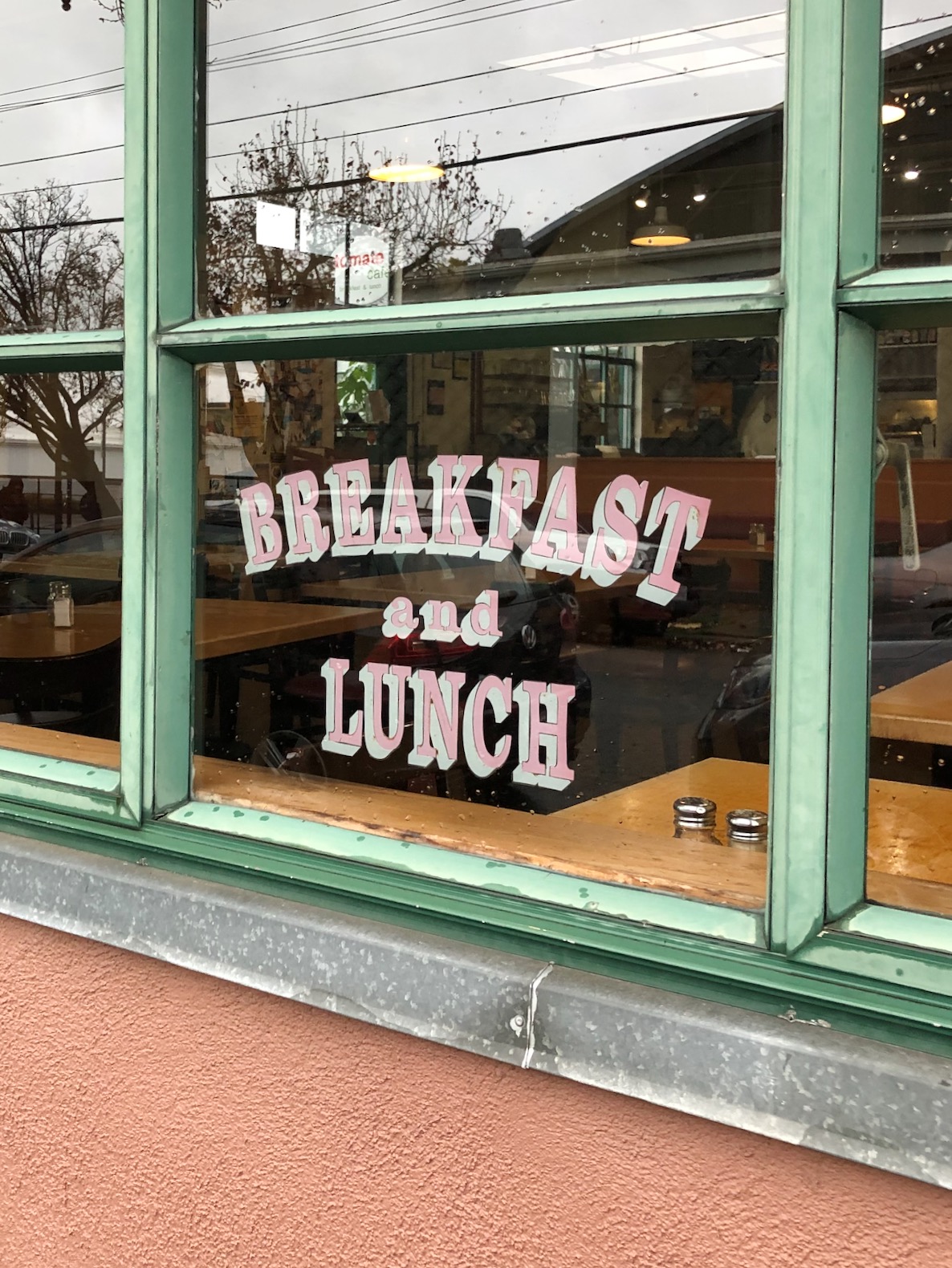 window of restaurant with breakfast and lunch sign